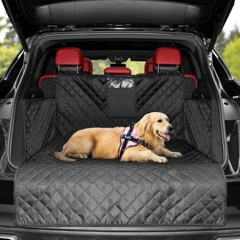 Dog sitting on a black car bench cover in a vehicle