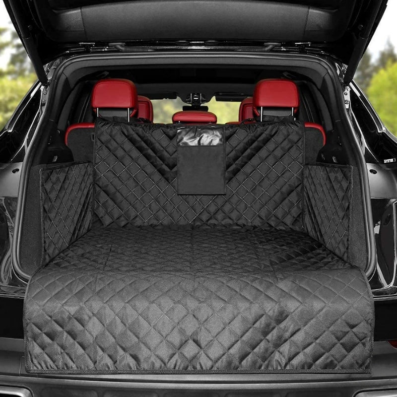 Black quilted car bench cover in a vehicle with red interior