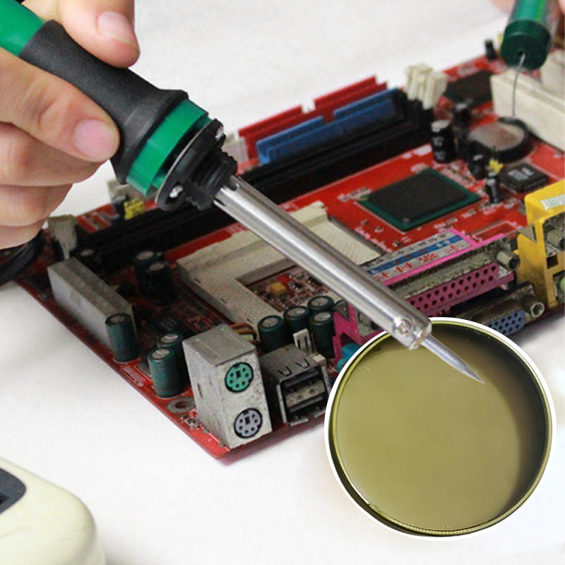 Person working on a circuit board with a magnifying glass and screwdriver.