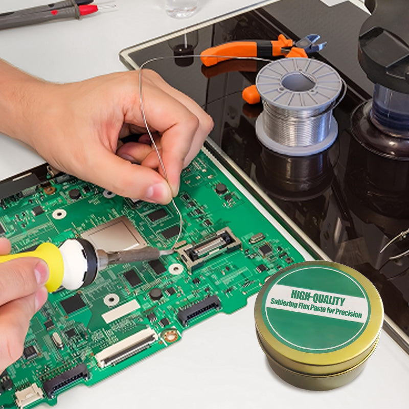 Person working on a circuit board with a can of high-quality soldering flux paste.